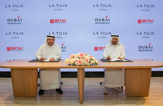 Dubai Holding Real Estate CEO, Khalid Al Malik, alongside Metac General Contracting Co General Manager, Muhammad Sadiq Abdullah, officially signs the construction contract to expand Villanova with 850 new homes.